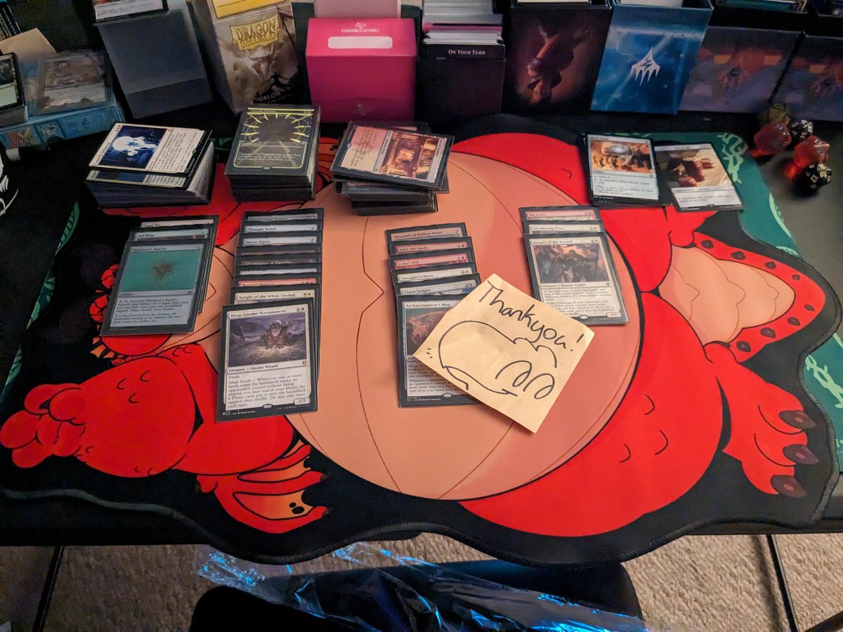 Ah-ha, I *can* play Magic on him! Mat is by @Bleucan. Check out his store here: bleucan.fish