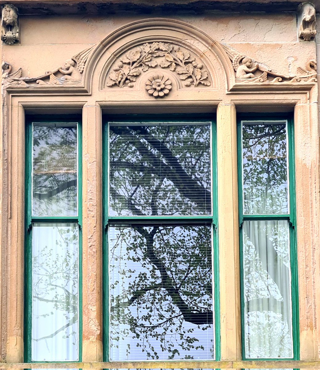 I love the details above these windows on a tenement on Peel Street in the Partick area of Glasgow, especially the cherubs in boats getting pulled along by swans. 

Cont./

#glasgow #architecture #glasgowbuildings #partick #sculpture #design #cherubs #window #windowswednesday