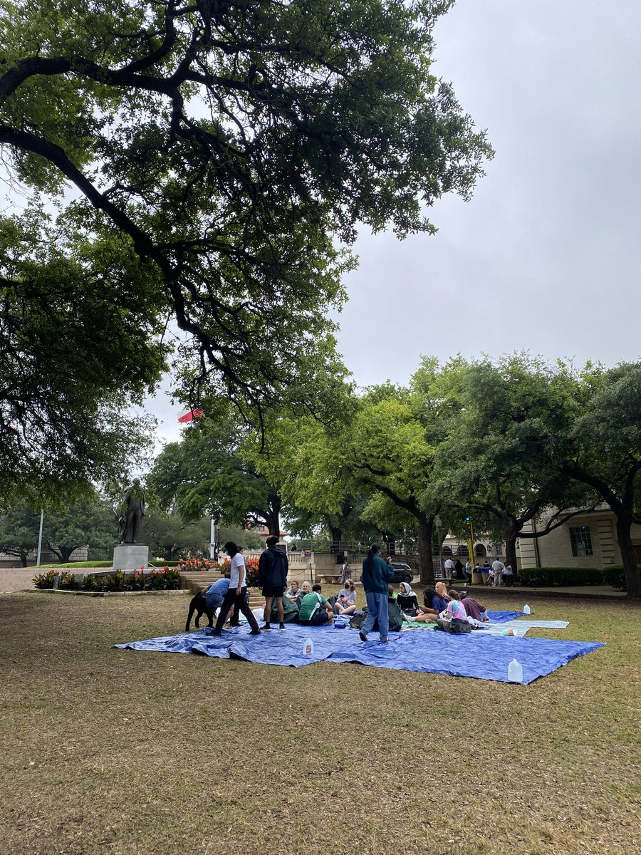 It’s a quiet and gloomy day out today. About 16 folks are gathered at UT Austin, they’ve laid out tarps to cover the wet grass. There was a larger event scheduled today, but it got moved to Sunday. Lots of UT admin and police patrolling the area.