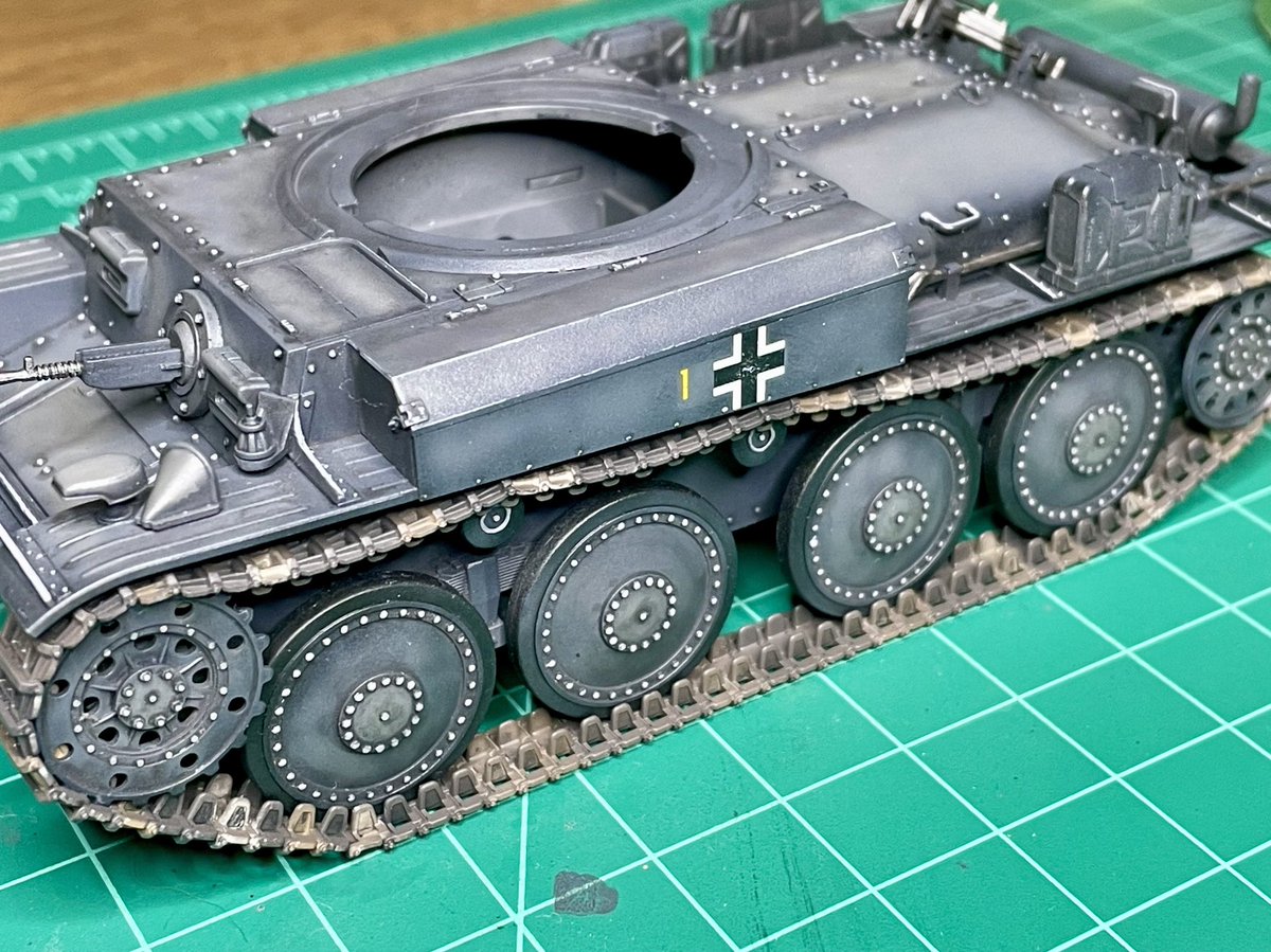 Debate: When do you add tracks to your tank model?

I opted to add these 38(t) link-and-length tracks after building and painting the hull, but before weathering.