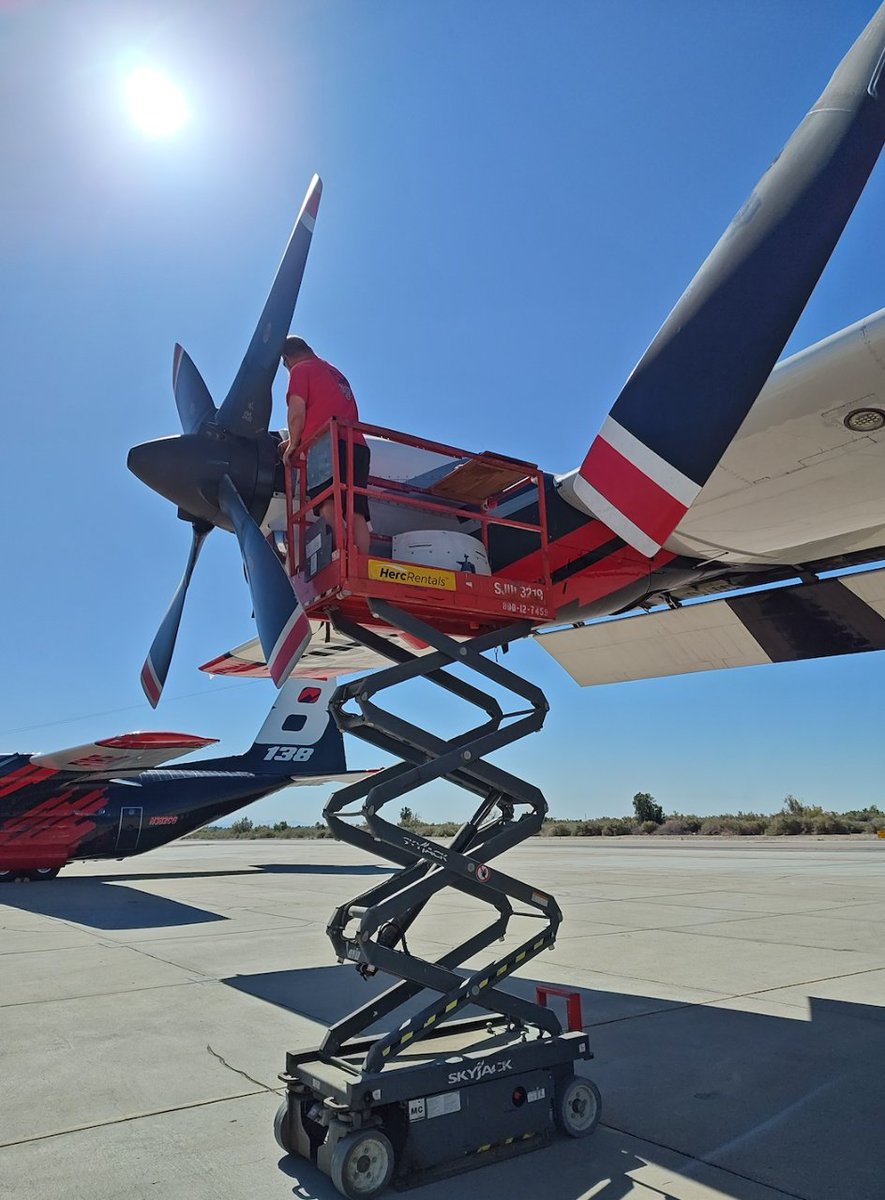 Tanker 138 sneaks into the shot as Tanker 132 undergoes maintenance on the ramp - our aircraft assets are just about ready to take on the U.S. fire season! #coulsonaviation #aerialfirefighting #aircraftmaintenance