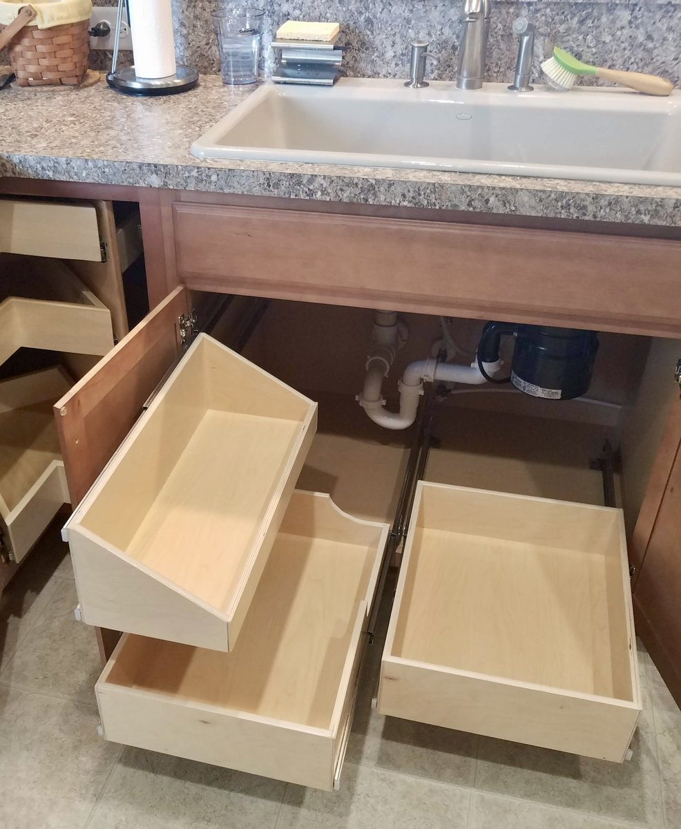 Don't let your plumbing get in the way of adding pull-out shelves under the sink!

See more ideas at shelfgenie.com

#kitchendesign #spacesaver #organization #kitchenmakeover #ShelfGenie #kitchenorganization #pullouts #glideouts #shelves #cabinets