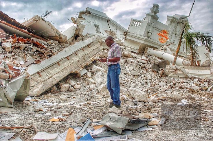 A man stands among the rubble of The Supreme Court building in Port-au-Prince, Haiti. 2010. Gary Moore photo. Real World Photographs. #earthquake #disaster #haiti #sweden #portauprince #garymoorephotography #realworldphotographs #nikon #documentary #newsphotography #photography