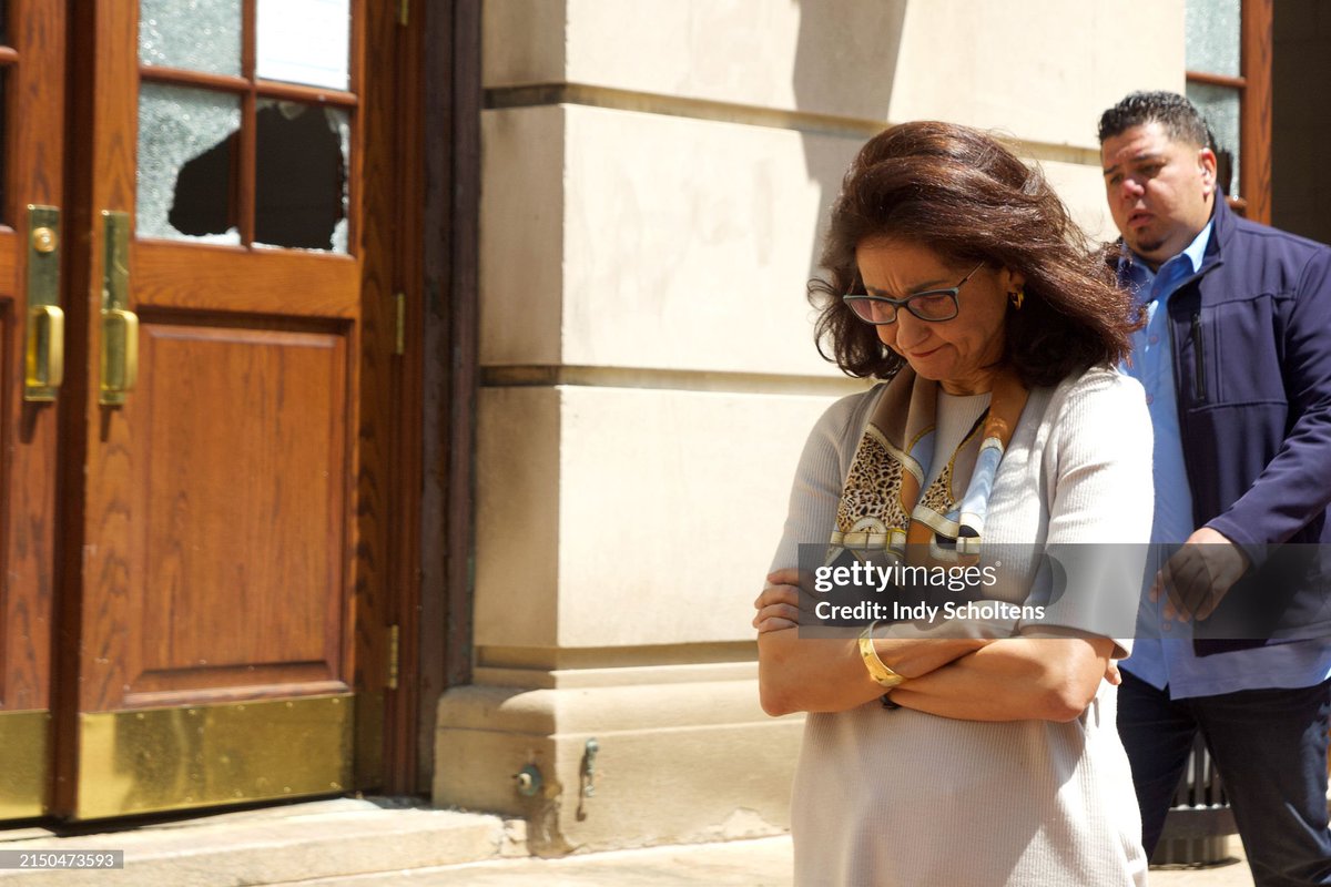 Columbia University President Minouche Shafik walks past a damaged door while visiting Hamilton Hall on campus. Police arrested nearly 100 people after demonstrators occupied the building overnight on Monday. In a statement today, Shafik writes, 'I know I speak for many members…
