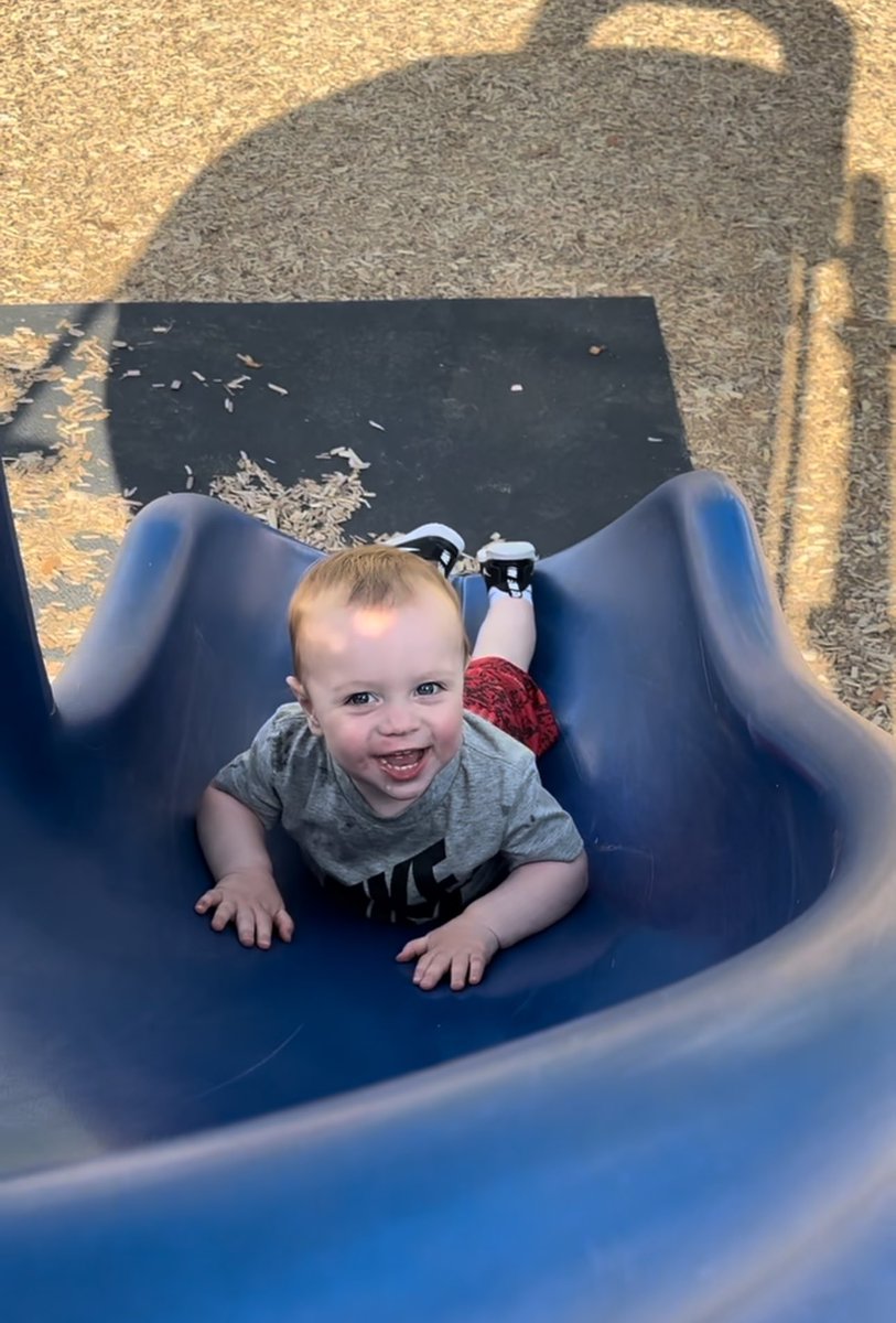 This guy loves slides, swings and seesaws!