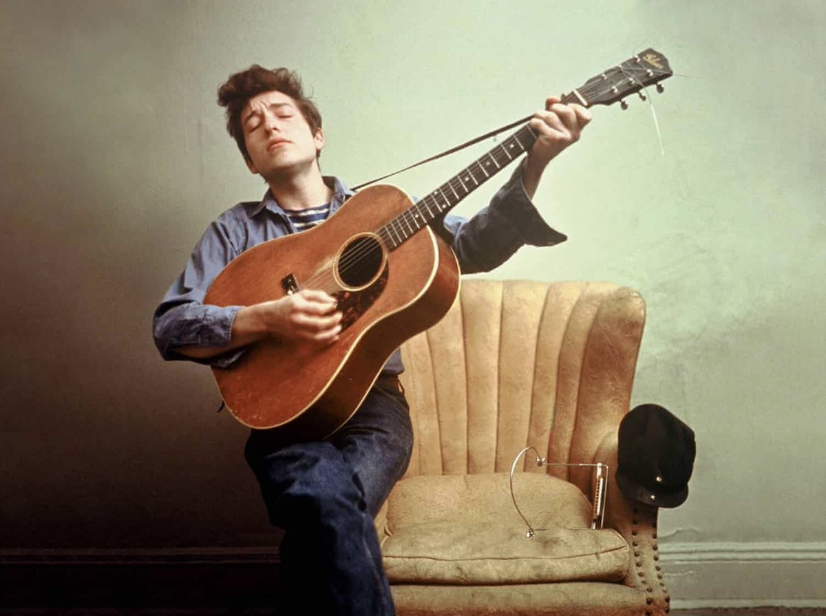 Bob Dylan performs in his apartment, West 4th Street, Greenwich Village, NYC, 1963. 📸: Don Hunstein. #BobDylan #Dylan