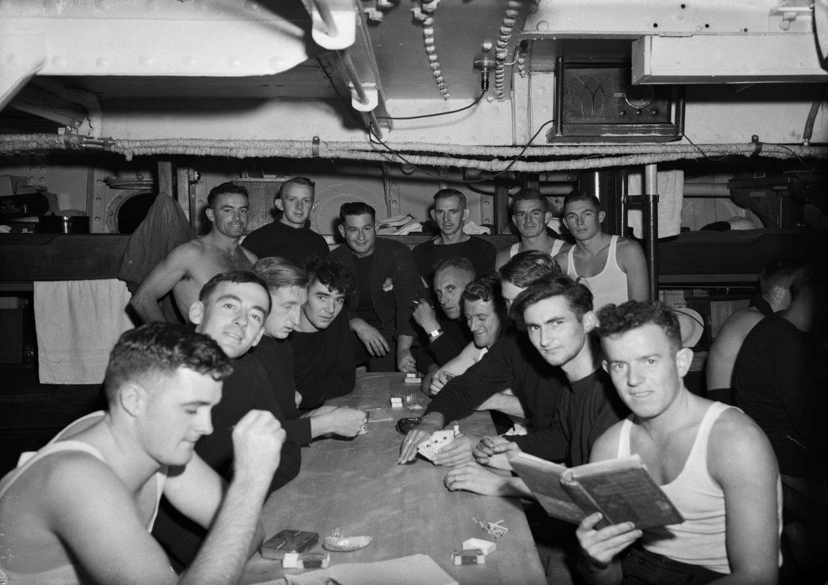 Crew relaxing in the mess deck onboard HMNZS Muritai (T05) ca. 1943. At the time this image by #TudorCollins was taken Muritai conducted shallow draft minesweeping from Tiritiri Matangi to Cape Rodney #WW2 #NZNavy #history