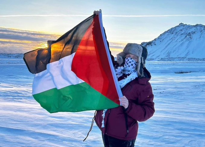 Palestinian supporter proudly holding the Palestinian flag in the Snaefellsnes peninsula, Iceland.