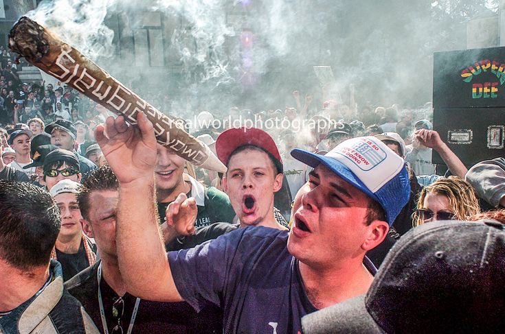 A massive joint is smoked at a 420 cannabis event in Vancouver, British Columbia, Canada. Gary Moore photo. Real World Photographs. #cannabis #pot #joint #marijuana #vancouver #canada #smoke  #britishcolumbia #garymoorephotography #realworldphotographs #nikon #photojournalism