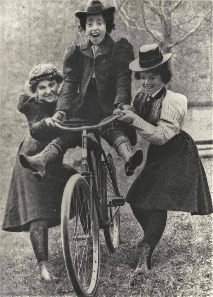 A woman Learning to ride a bicycle, in 1895.