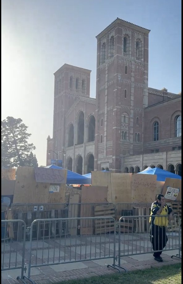 Just barely visible on the right side of this screen grab from a Fox reporter's livestream of the protest at UCLA, there is a 'Burma 4 Palestine' sign stuck to a piece of plywood. You can see it it other footage as well.