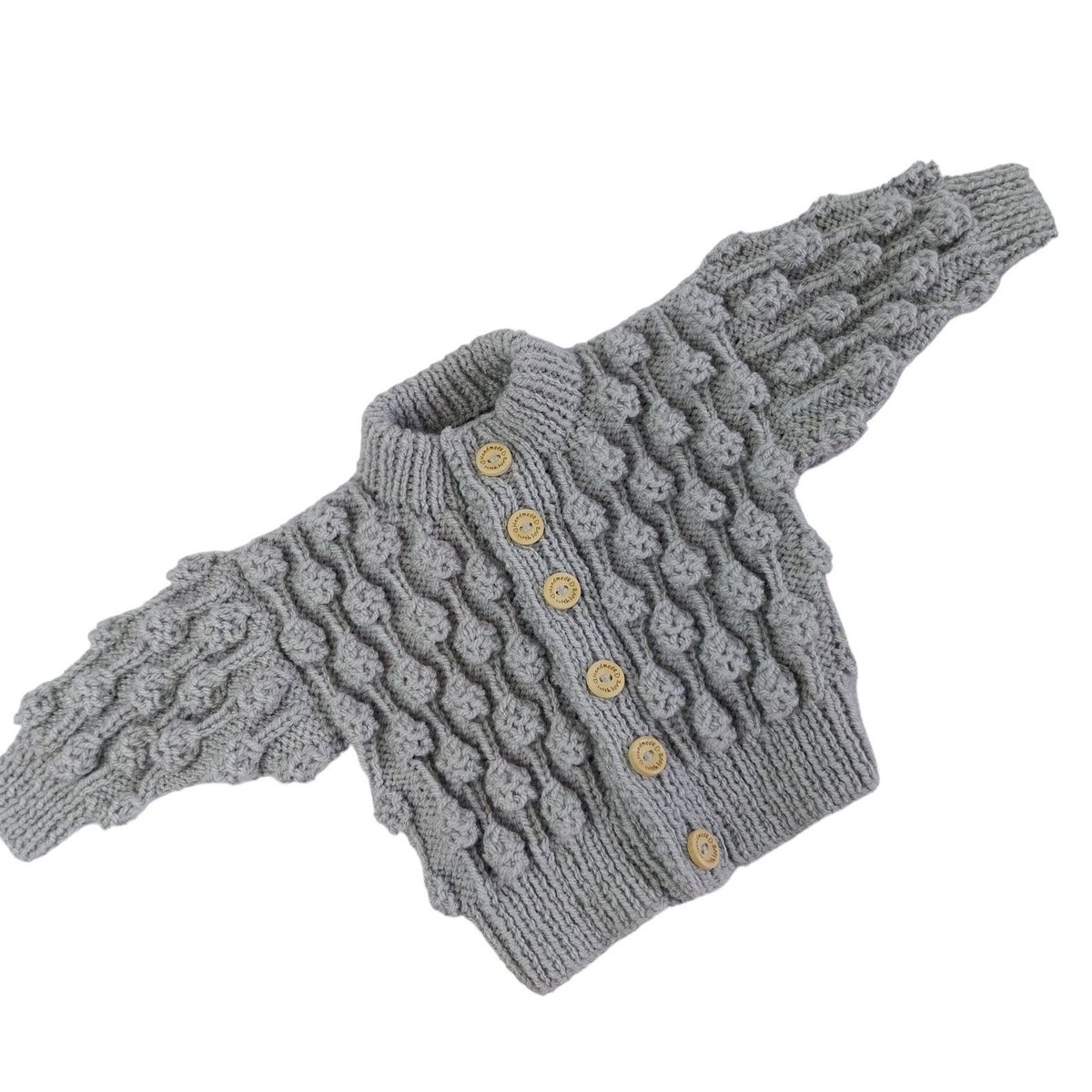 Check out this adorable hand-knitted baby cardigan! Made with love using a silver grey yarn and featuring a textured bobble pattern. Perfect for little ones aged 0-6 months. Get yours today at #Knittingtopia on #Etsy knittingtopia.etsy.com/listing/171754… #babygifts #MHHSBD #craftbizparty