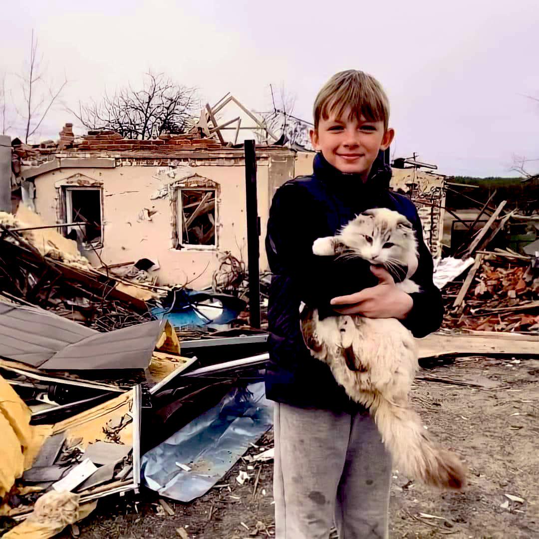 Child's happiness is when you find your cat alive in the ruins of the house you lived in