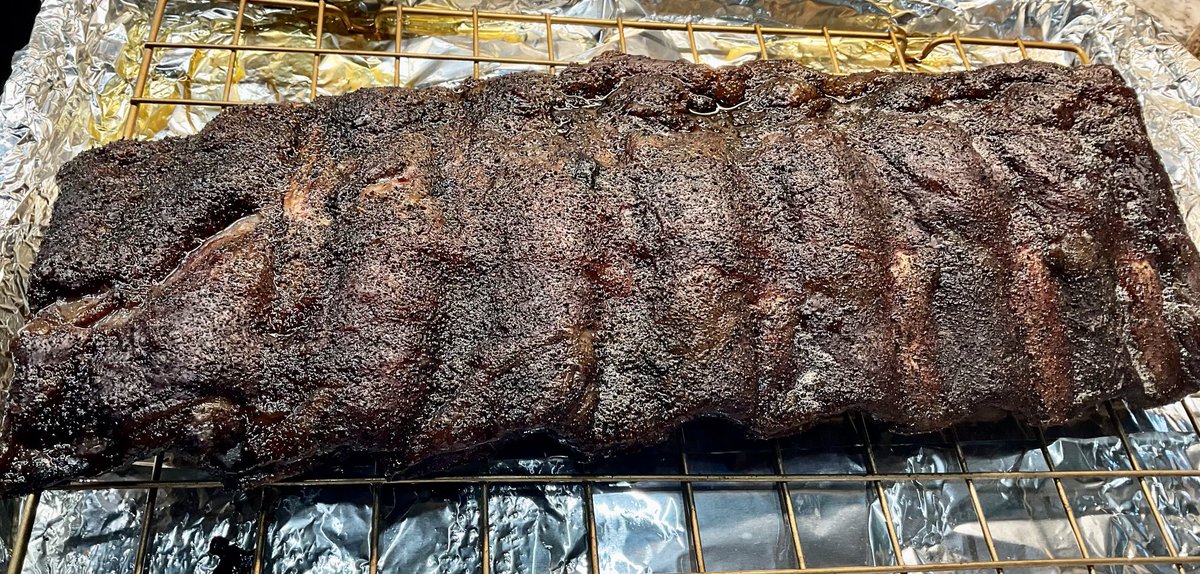 These beef ribs are looking pretty dang good. Not quite done. No pullback yet but the bark is on point.