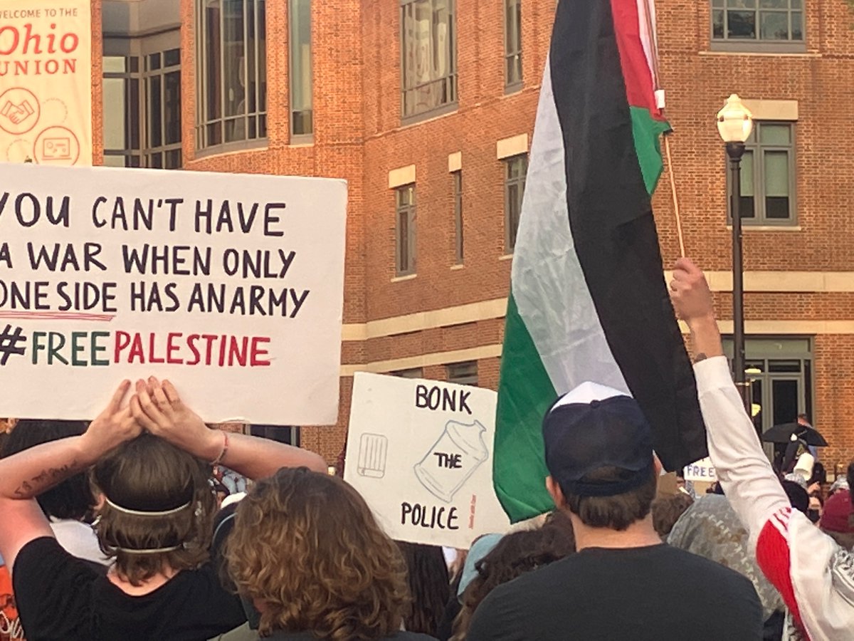 tons of solidarity between campus anti-genocide encampments across the country —  & world — on display at the ohio state university tonight. pictured here: a sign referencing cal poly’s occupation, featuring a water bottle, which has become a meme of the student occupations.