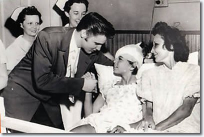 Elvis Presley visiting a 12 year old at St. Joseph’s hospital in Tennessee, 1956