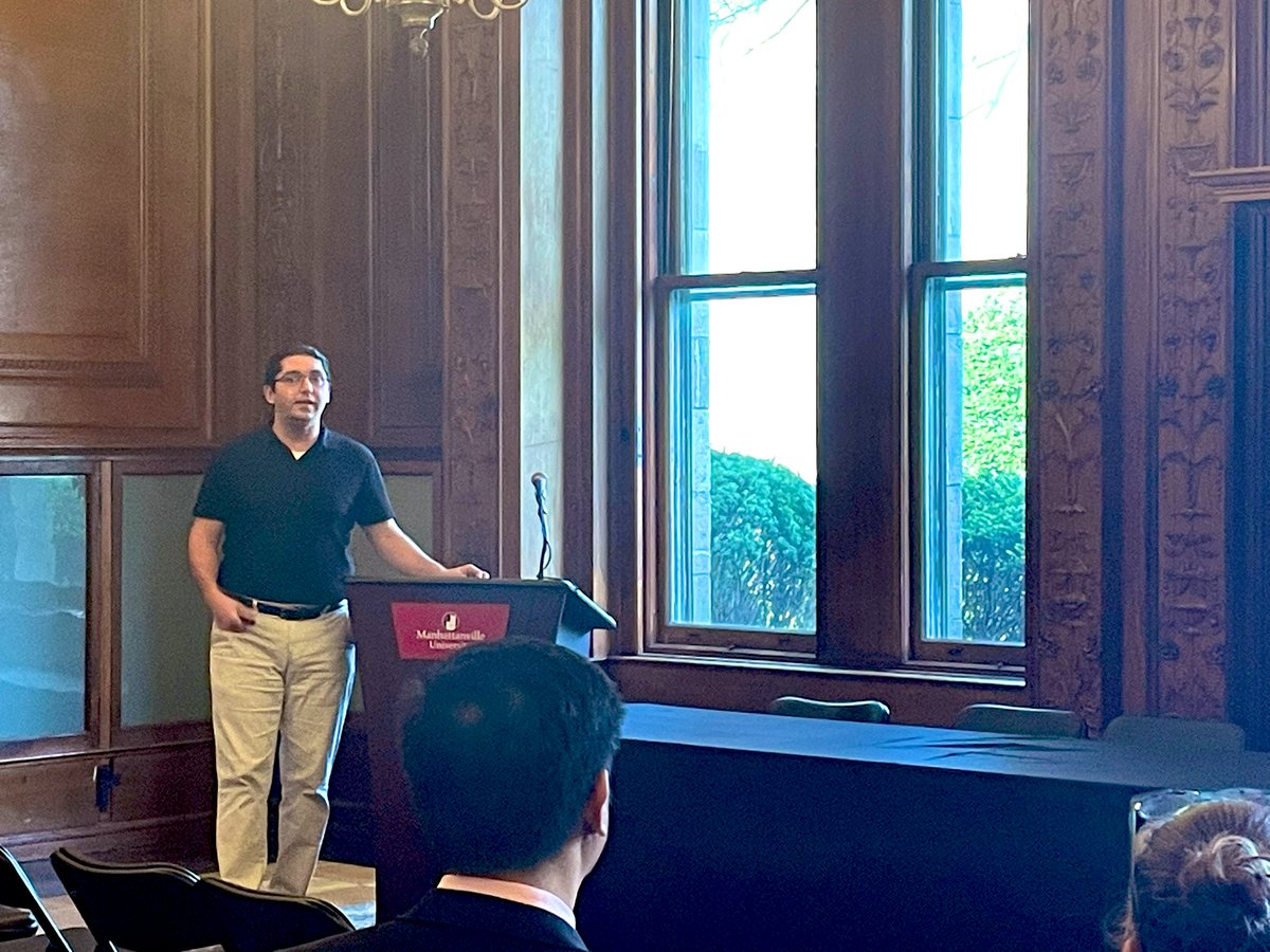 Manhattanville University doctoral student Cody Blume presents his research at today’s Research Forum.