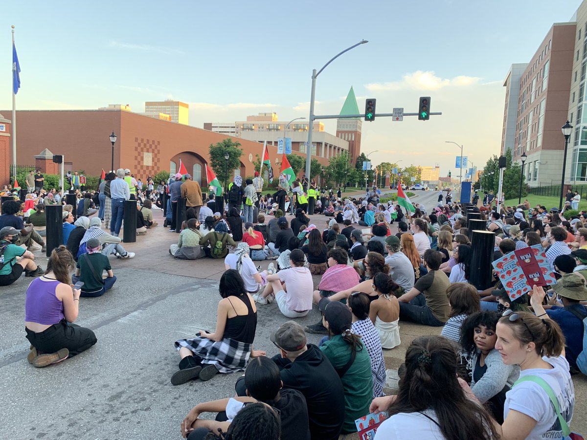 Anti-war protestors at SLU have started to sit in a circle on Grand. Haven’t seen any SLMPD here besides a few SUVS blocking traffic at Laclede and Lindell.