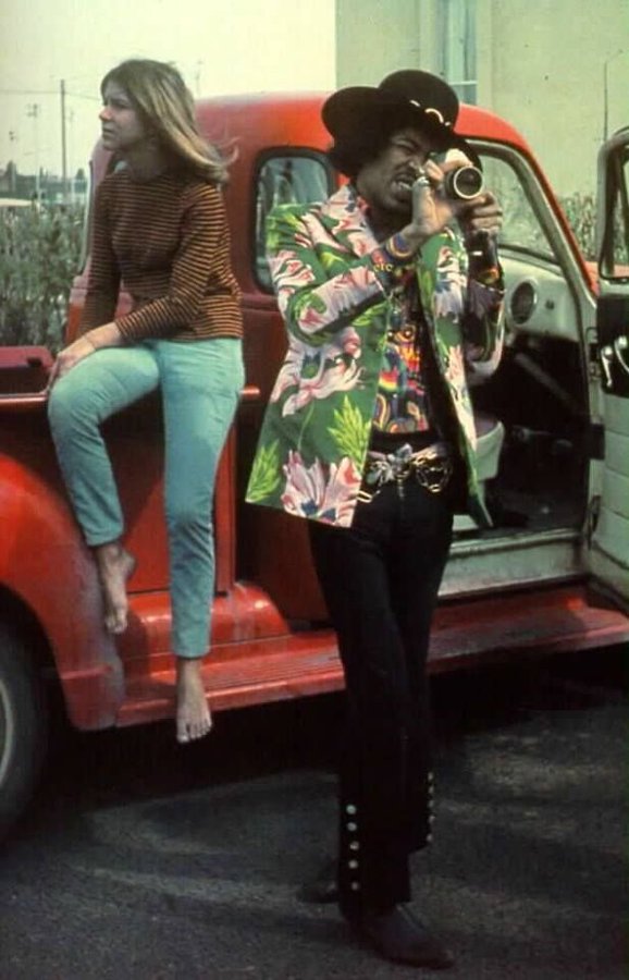 Jimi Hendrix filming by a pickup truck with his girlfriend, 1967