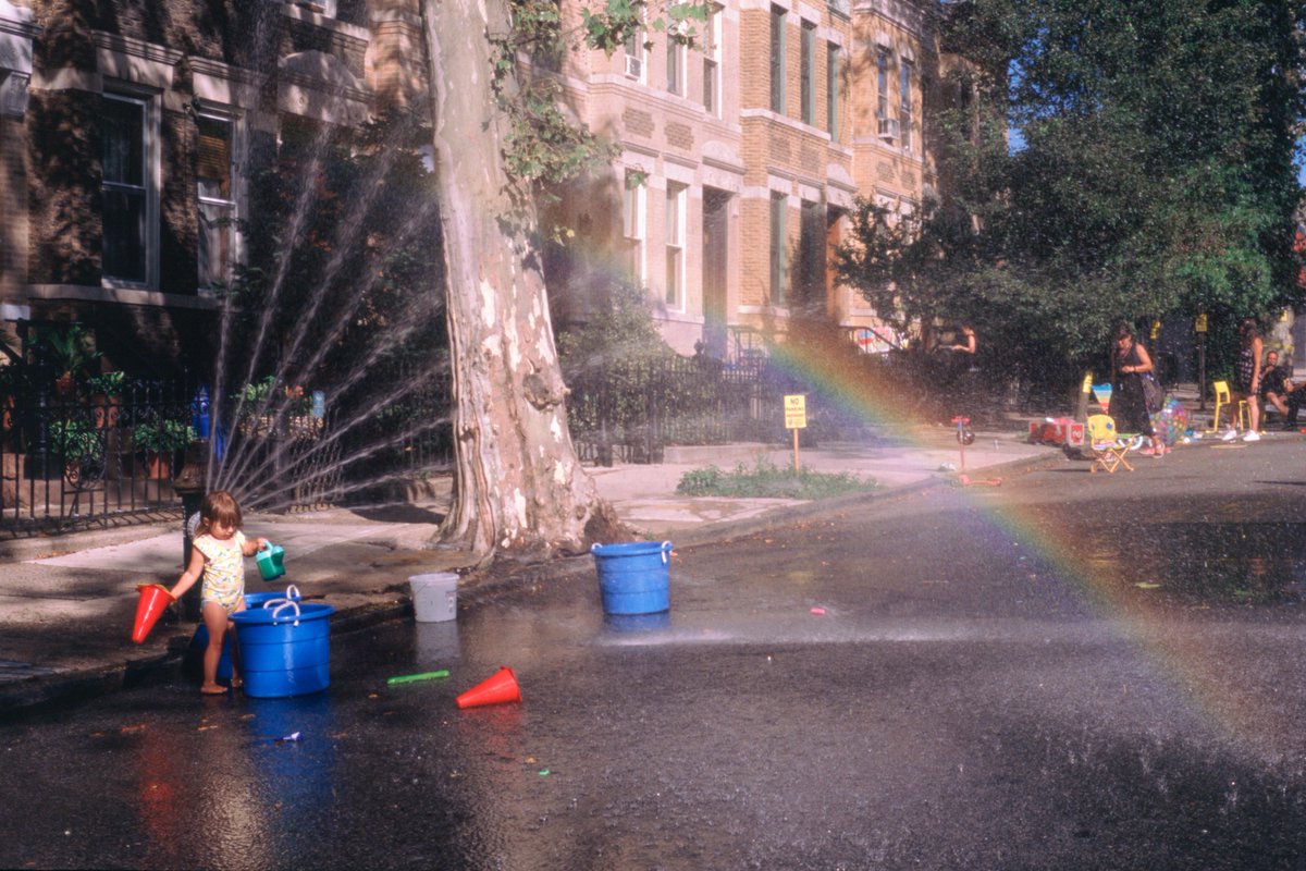 In the summer of 2019, I took this photo of a child playing just like how I used to

The rainbow, the childish joy, the cool mist on a hot day. It transported me back

When I started working on The Suburbs, I knew I needed to capture these feelings