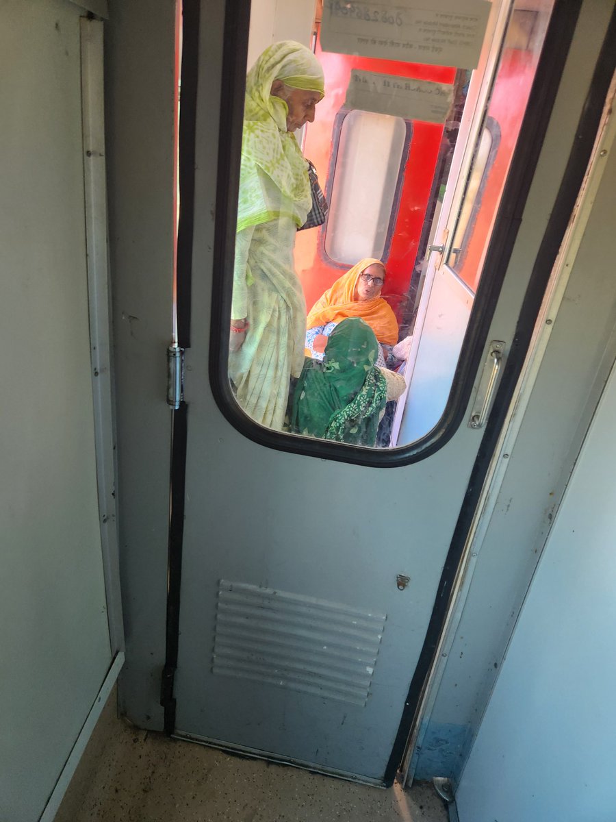 The horror on Train no 22949 Delhi Saria Rohilla train first ac continues. Outside my cabin right now when I woke up and went to use the washroom. I couldn't even click the others on the right as I couldn't walk past these women. I asked the attendant, and he says this is how it…