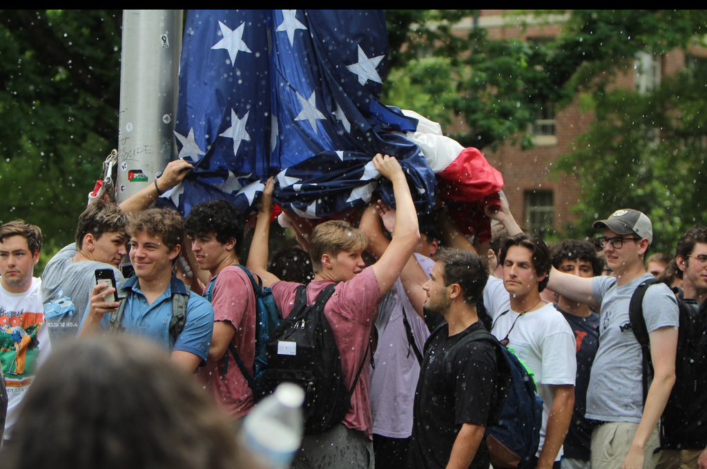 Patriotism. These young men defending the flag are the same age as the greatest generation was when they went to save America from the Nazis. We will save America again from the insanity of those who hate her.