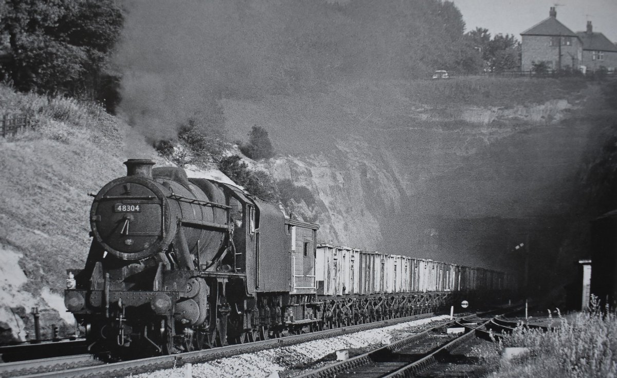 8F 48304, has just emerged from Sherwood Rise tunnel with a train of 16-ton mineral empties heading for Annesley. Date: 29th July 1963 📷 Photo by T. Boustead. #steamlocomotive #1960s #Nottinghamshire #BritishRailways