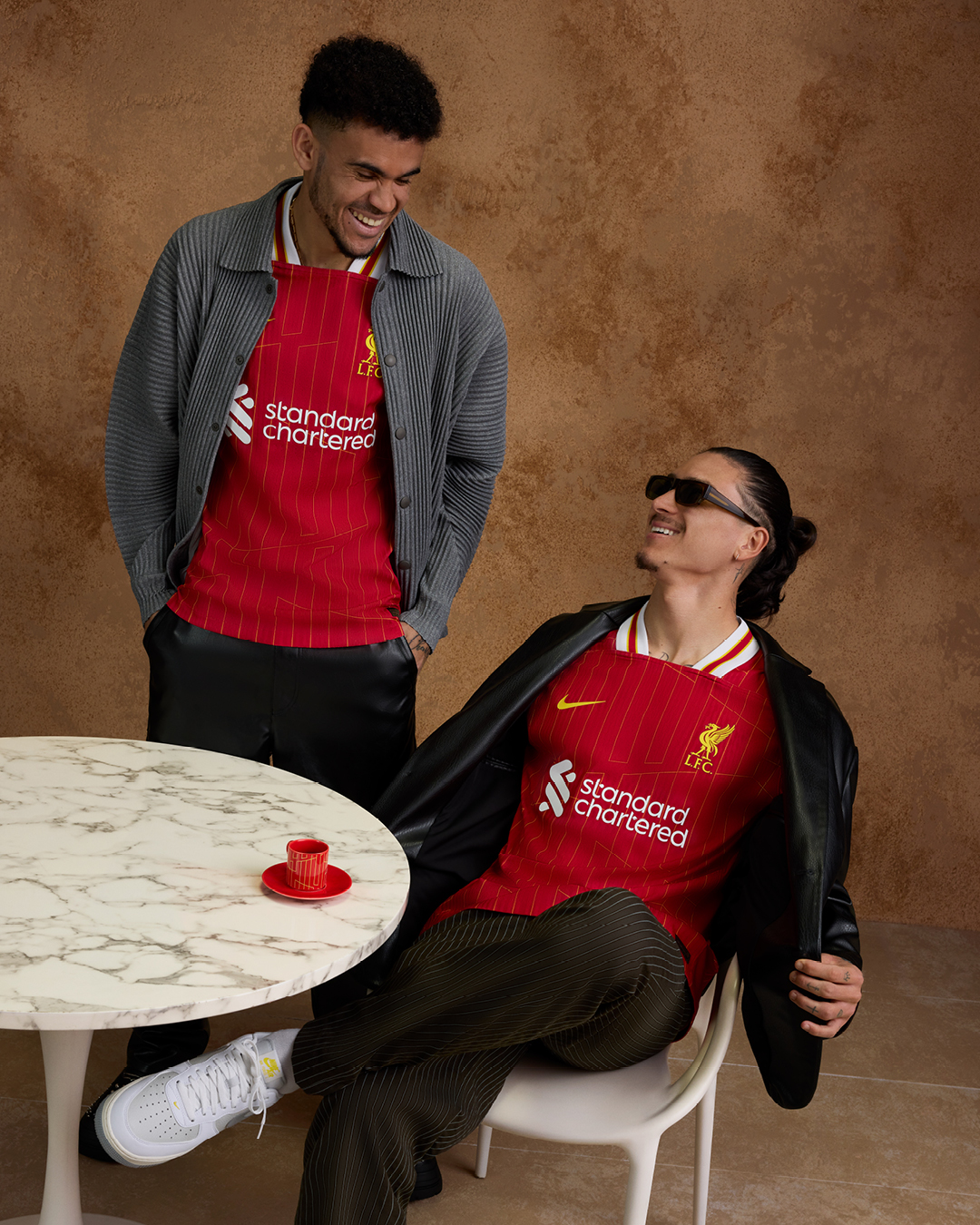 Luis Diaz and Darwin Nunez pose in our new 2024/25 home kit.The kit is inspired by our European Cup win in Rome 1984.