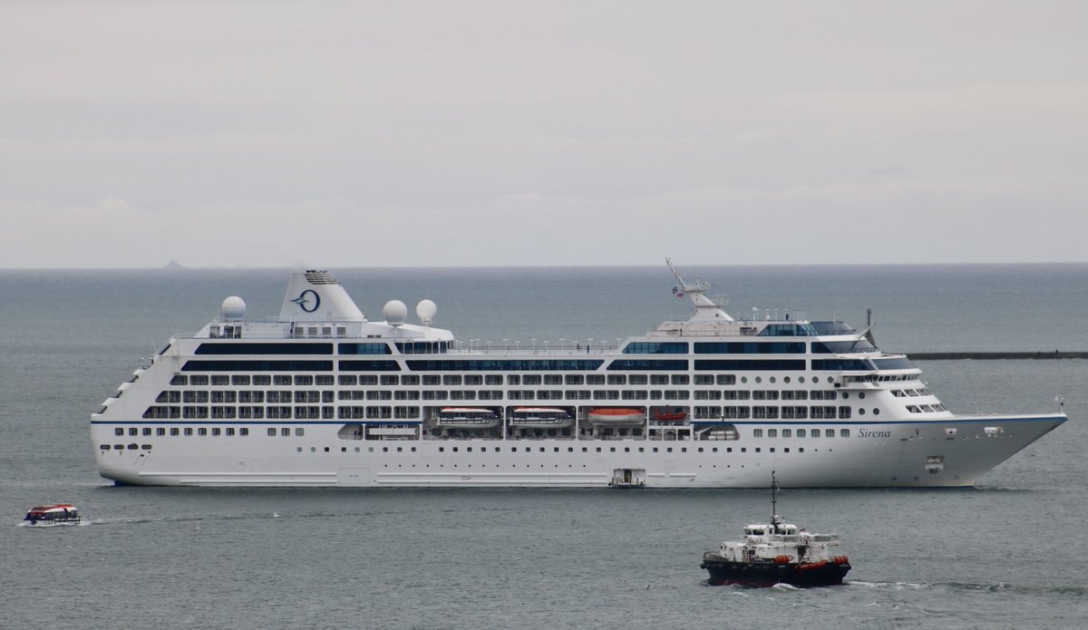 The weather is lifting around the elegant Sirena cruise liner at anchor in the Sound, and features 11 decks, and provides accommodation for 684 guests in double-occupancy rooms. The vessel has 400 crew members. westwardshippingnews.com contact@westwardshippingnews.com