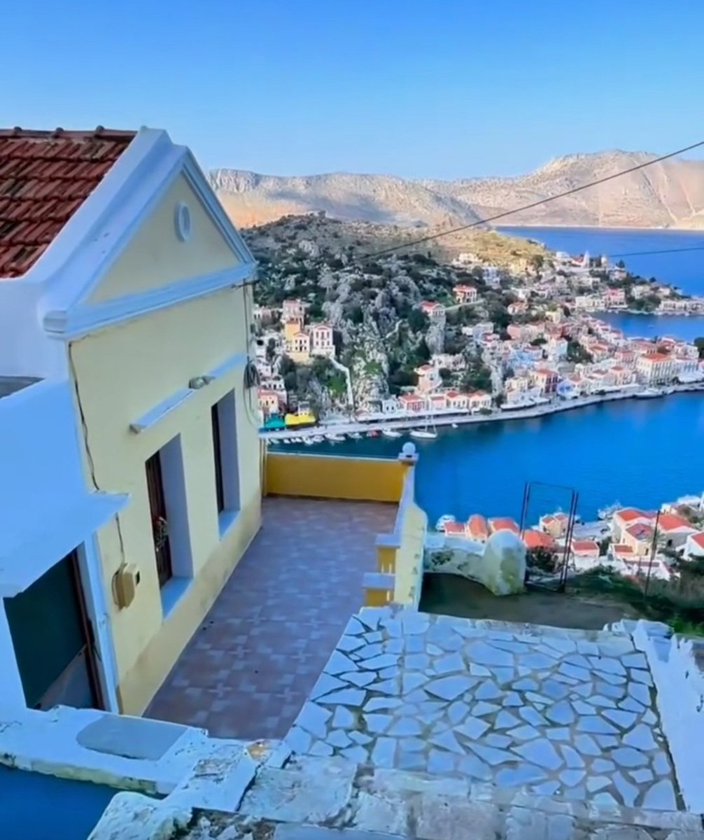 Good morning from the picturesque Greek island! The vibrant blue sea and sky perfectly complement the white church and harbor below. #serenity #GreekIslandLife