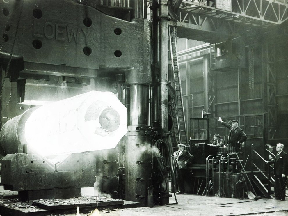 A 35 ton ingot being forged in the 2700 ton press at Hadfield's East Hecla Works, Sheffield, 1955.