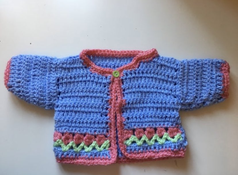 It’s #babyday 👶🏻Here’s a cardigan with tulips at the bottom 👶🏻 All sales include a charity donation to @blisscharity or @TheSCT so another baby can be helped. ❤️ okthenwhatsnextcraft.etsy.com #crochet #etsy #earlybiz #elevenseshour