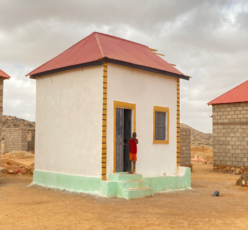 Halima Mohamed painting her newly constructed home🛖 ,Hoodale site. Through @Danwadaag_DS 545 shelters with elevated foundation and made of waterproof materials have been built to mitigate the effects of floods.
