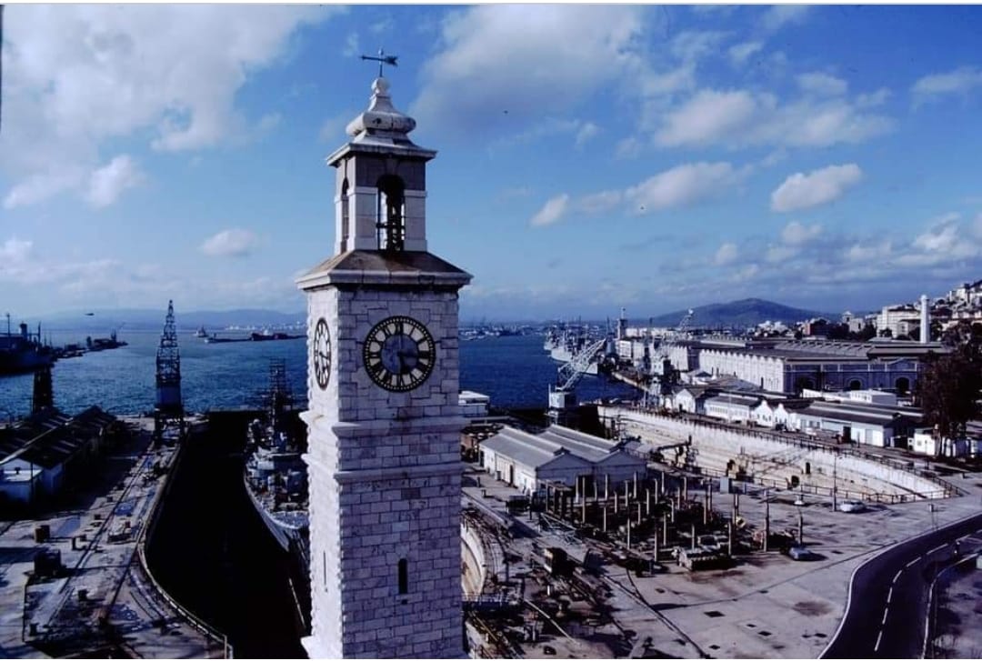 #ThrowbackThursday to HM Naval Dockyard circa 1979-80, with a photo taken from Tower buildings. Here you can see a Royal Navy Leander-class frigate undergoing a refit in No.2 Dock! #Gibdock #Gibraltar #RoyalNavy #Drydock #Dockyard #Shipyard #ClockTower #MaritimeHistory