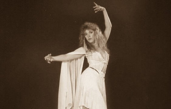 You look like Stevie Nicks In ‘75 the hair and the lips Crowd goes wild at her fingertips