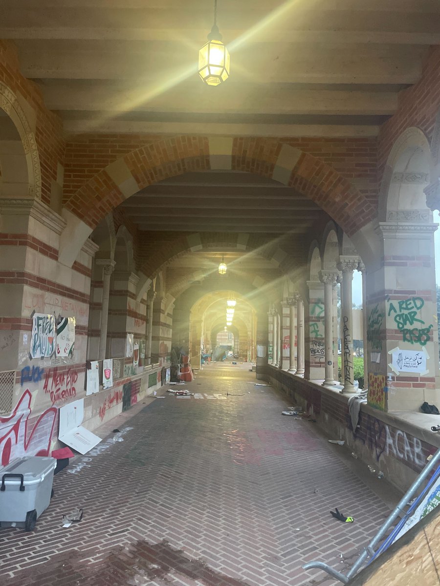 Royce Hall was left covered in graffiti after police cleared the encampment. Phrases painted on the walls included 'Divest from genocide' and 'Free Gaza.'