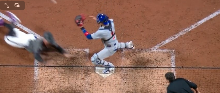 If the rule is followed, this is wrong. The catcher just cannot be on the plate without the ball. But personally, I don't think he did anything wrong. This is the game. And the rule - whether the umps got it right or wrong - stinks.