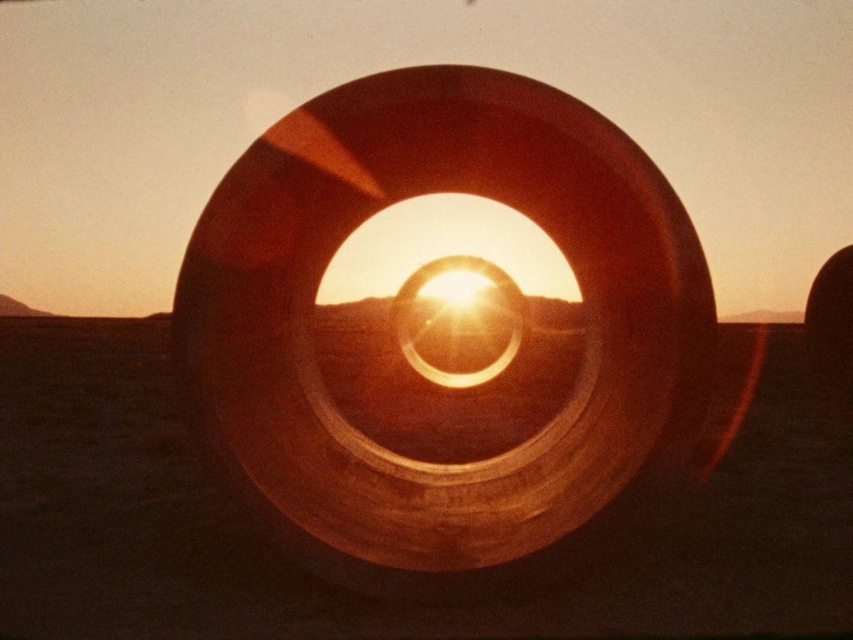 Nancy Holt's film Sun Tunnels explores the processes of the creation of her work, made of four large concrete tunnels in the Utah desert. They're positioned to bring, as she said, “the stars down to earth” & are aligned with the sunrise & sunset of the summer & winter solstices.