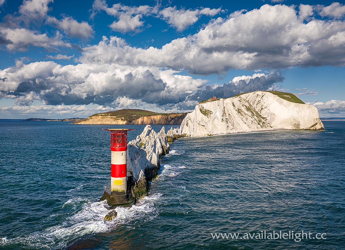 'Fluffy clouds over the Needles' 🫶🏽 📌 The Needles: Landmark Attraction⁠ 📷️ availablelightphotography (IG) #exploreisleofwight #coastalwalk #view #seaview #pretty #WestWight #TheNeedlesLandmarkAttraction #dramatic #seascapephotography #landmark #sunset #clouds