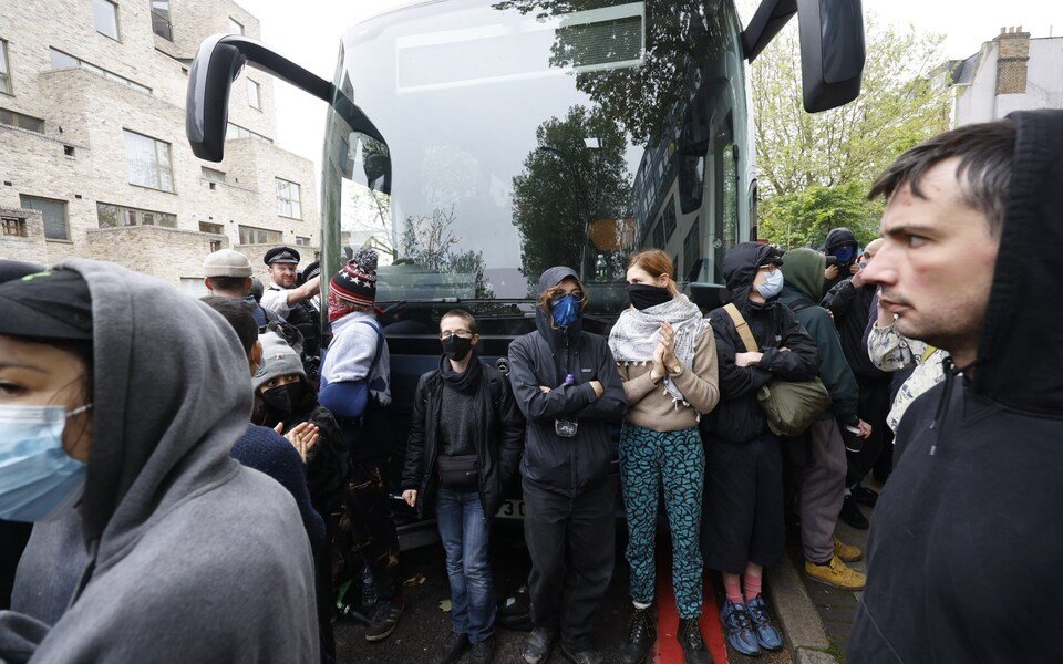 Protesters attempting to stop migrants being removed from a London hotel have slashed the tyres of a coach set to transport them. The migrants were being moved to the Bibby Stockholm barge in Dorset.