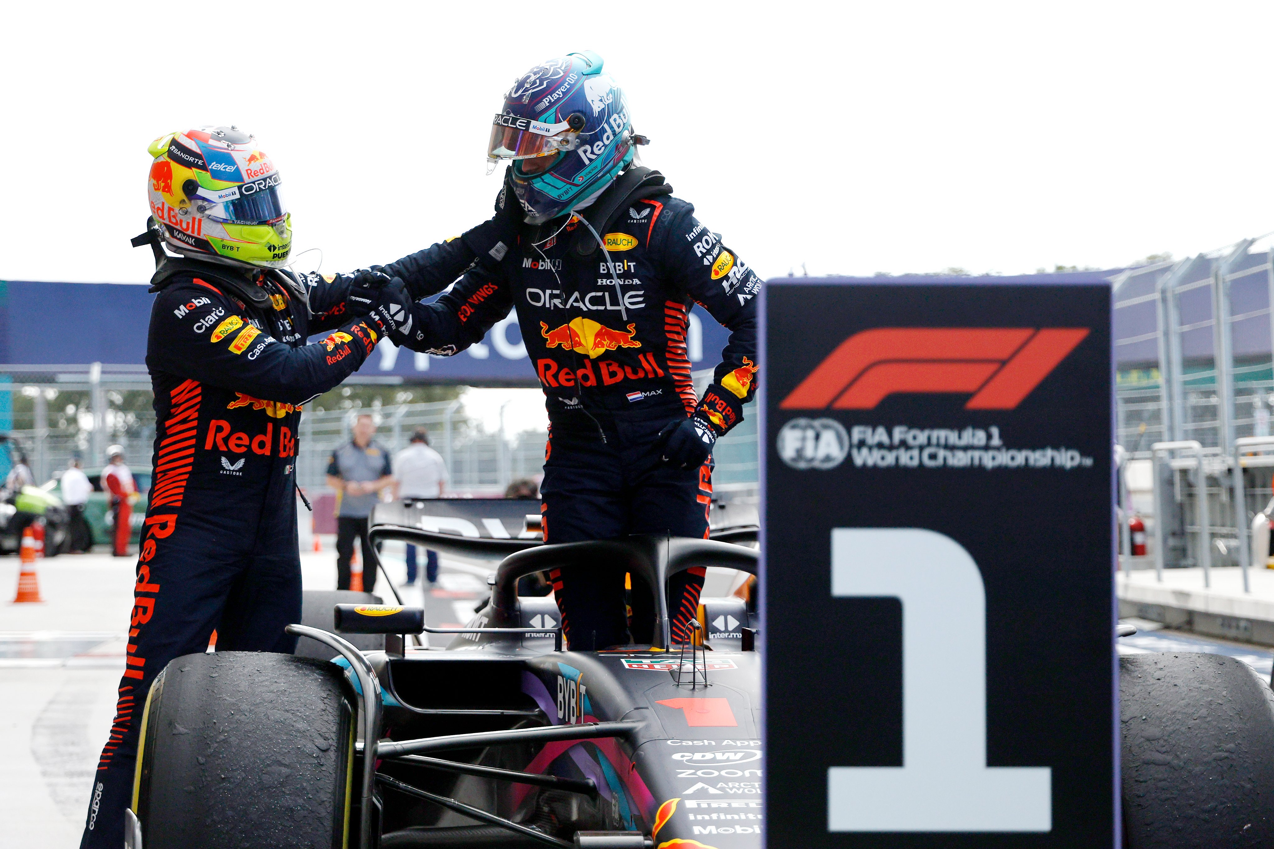 Checo Perez and Max Verstappen shake hands in Parc Ferme at the Miami GP in 2023.