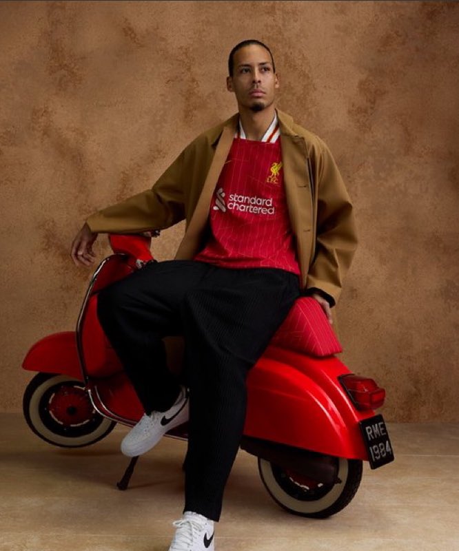 Inkedandunique's tweet photo. I bet my lad asks me for this with his y2k wearing clothes and this referencing Italia ‘84. At last he’ll be wearing Liverpool like his mumma 🫡

#LiverpoolFC #newkitlaunch #virg https://t.co/RqbCRrH46t