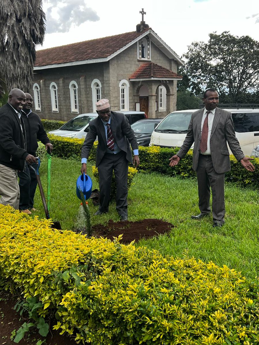 Director for Teachers' Education, Mr Abdul Khalil Karayi Planting trees at Kamwenja TTC during inspection.