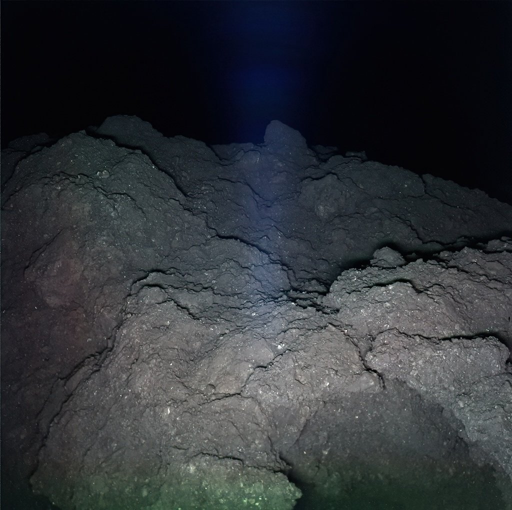 Clearest image ever taken of asteroid Ryugu. The pitch black background is scary...