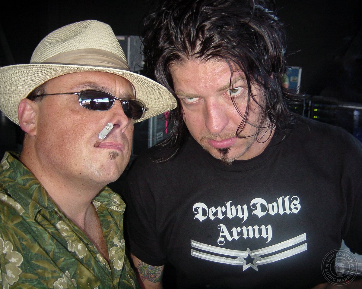 Here's a throwback image with James Root of @Slipknot and yours truly backstage at Ozzfest in Camden NJ 2004. Everyone else was dressed in black while I did the Hunter S. Thompson-thing with a straw fedora and cigarette holder. #Slipknot #ThrowbackThursday