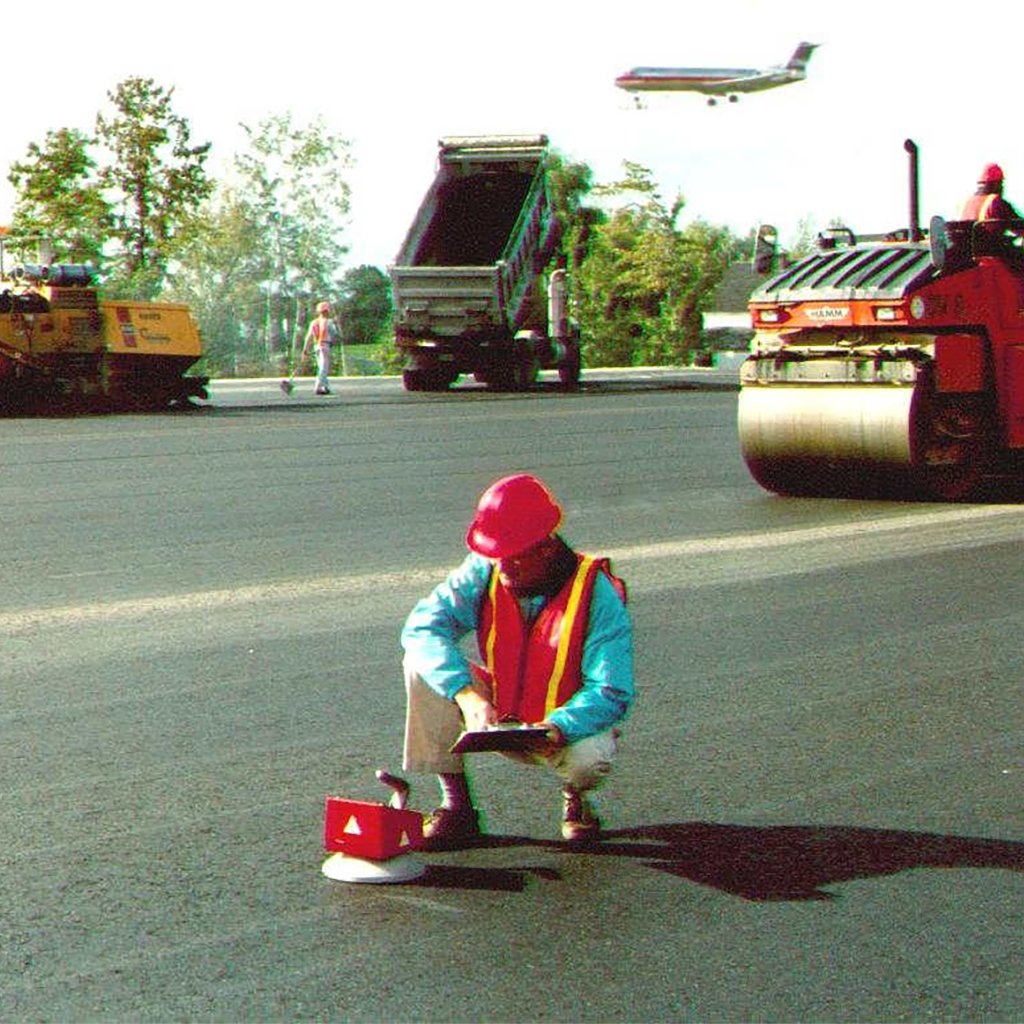 Throwback to 1998 with the #TransTechSystems engineering team at the Albany International Airport. 🛫 Collecting density data for quality control with an early generation #PQI #NonNuclear #AsphaltDensity gauge. ⚡ #ThrowbackThursday #AsphaltPaving #QCForEveryone #ALB