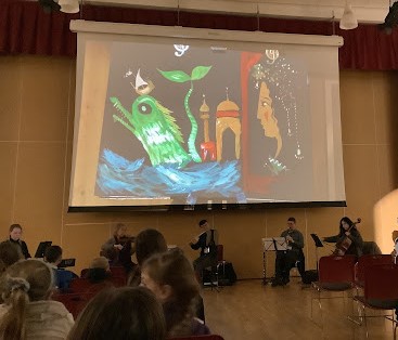 Y3 experienced an engaging concert with James Mayhew. The children were in awe of the beautiful music created by such a small orchestra and loved how quickly the artist's paintings were created! <a href="/ElliotSchools/">Elliot Foundation</a> <a href="/BrittenSinfonia/">Britten Sinfonia</a>