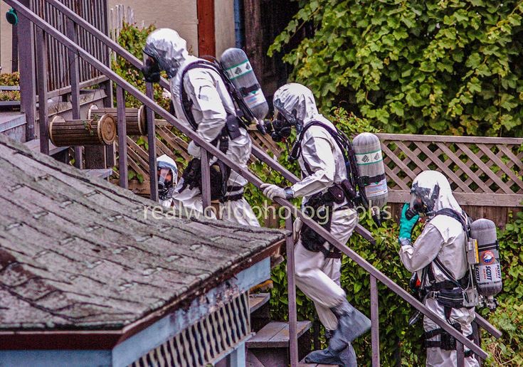 RCMP in protective gear bust a suspected drug house in Nanaimo, BC, Canada. Gary Moore photo. Real World Photographs. #police #rcmp #drugs #bust #cops #cities #garymoorephotography #realworldphotographs #nikon #photojournalism #newsphotography #photography