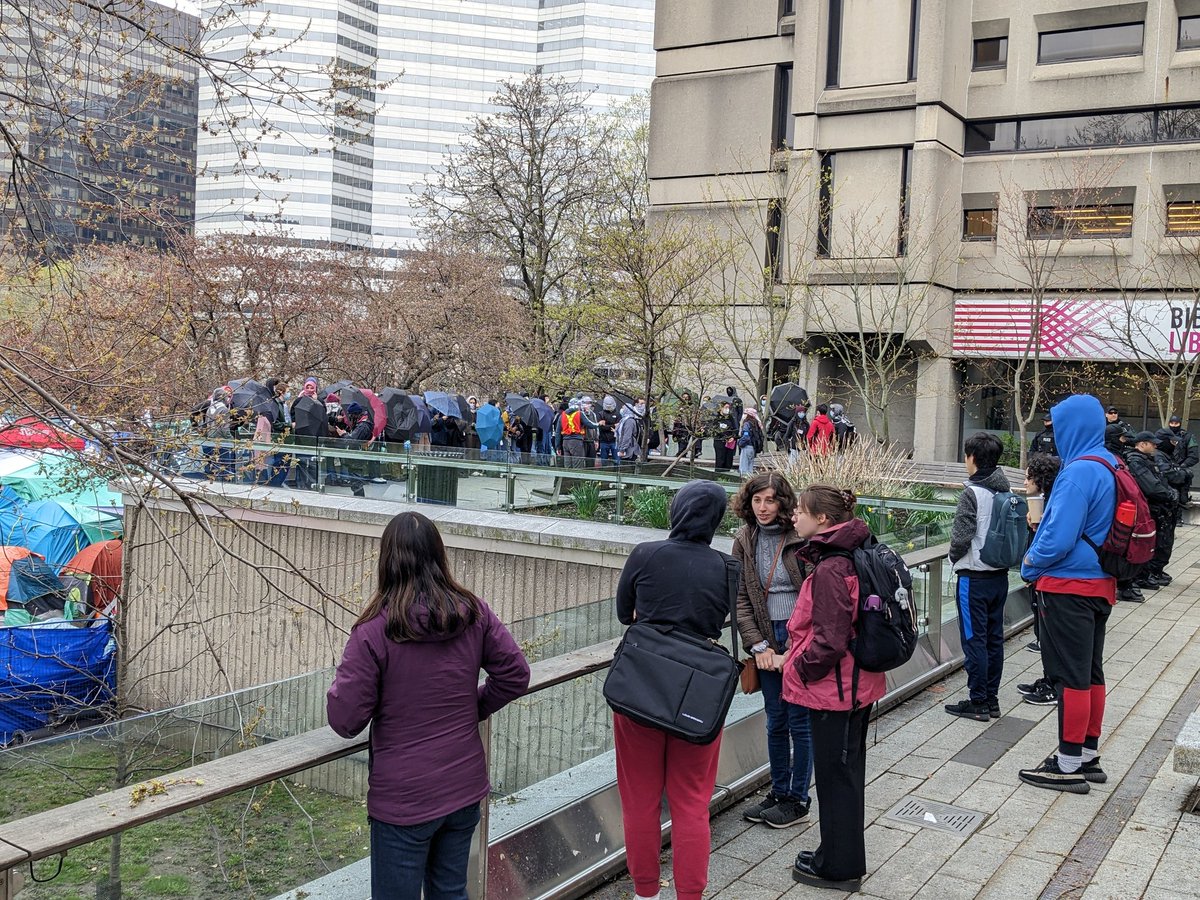 Hannah Liddle (@hjliddle) on Twitter photo The McLennan Library has a line of cops at the door.
Palestinian supporters stand with umbrellas to prevent journalists and onlookers from peering into the encampment.
<a href="/mcgillu/">McGill University</a> #StudentProtests The McLennan Library has a line of cops at the door.
Palestinian supporters stand with umbrellas to prevent journalists and onlookers from peering into the encampment.
<a href="/mcgillu/">McGill University</a> #StudentProtests