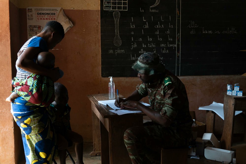 A patient awaits prescription medication from a Benin Armed Forces member during the Medical Civic Action Program in Cana, Benin, July 19, 2023. U.S. forces regularly engage in MEDCAPs to work alongside African partners and provide medical care to remote communities.